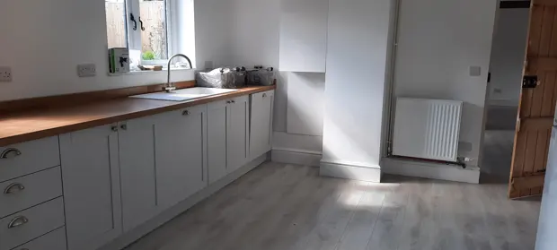Empty kitchen with clean worktops and cupboards