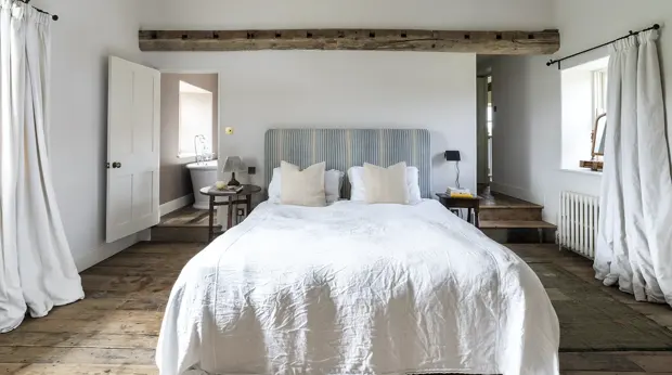 Bedroom with a freshly made bed